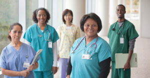 diverse nursing group stands together