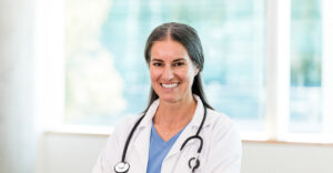 Nurse practitioner smiles at camera